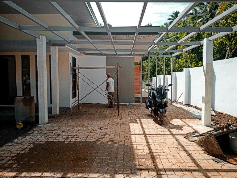 Person cleaning pavers