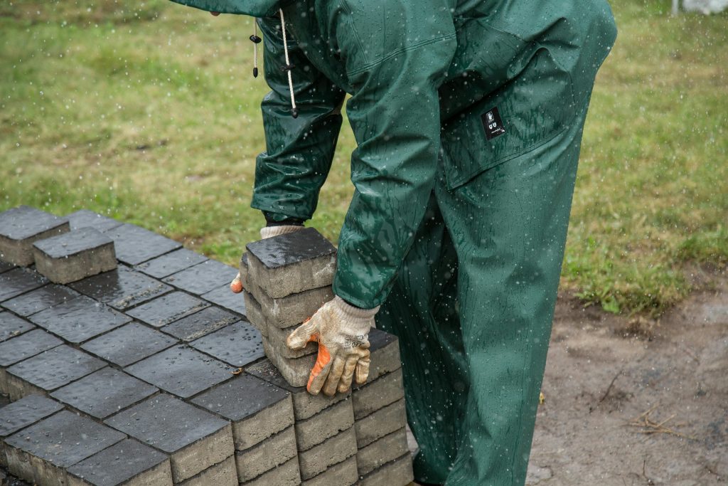 Person stacking pavers