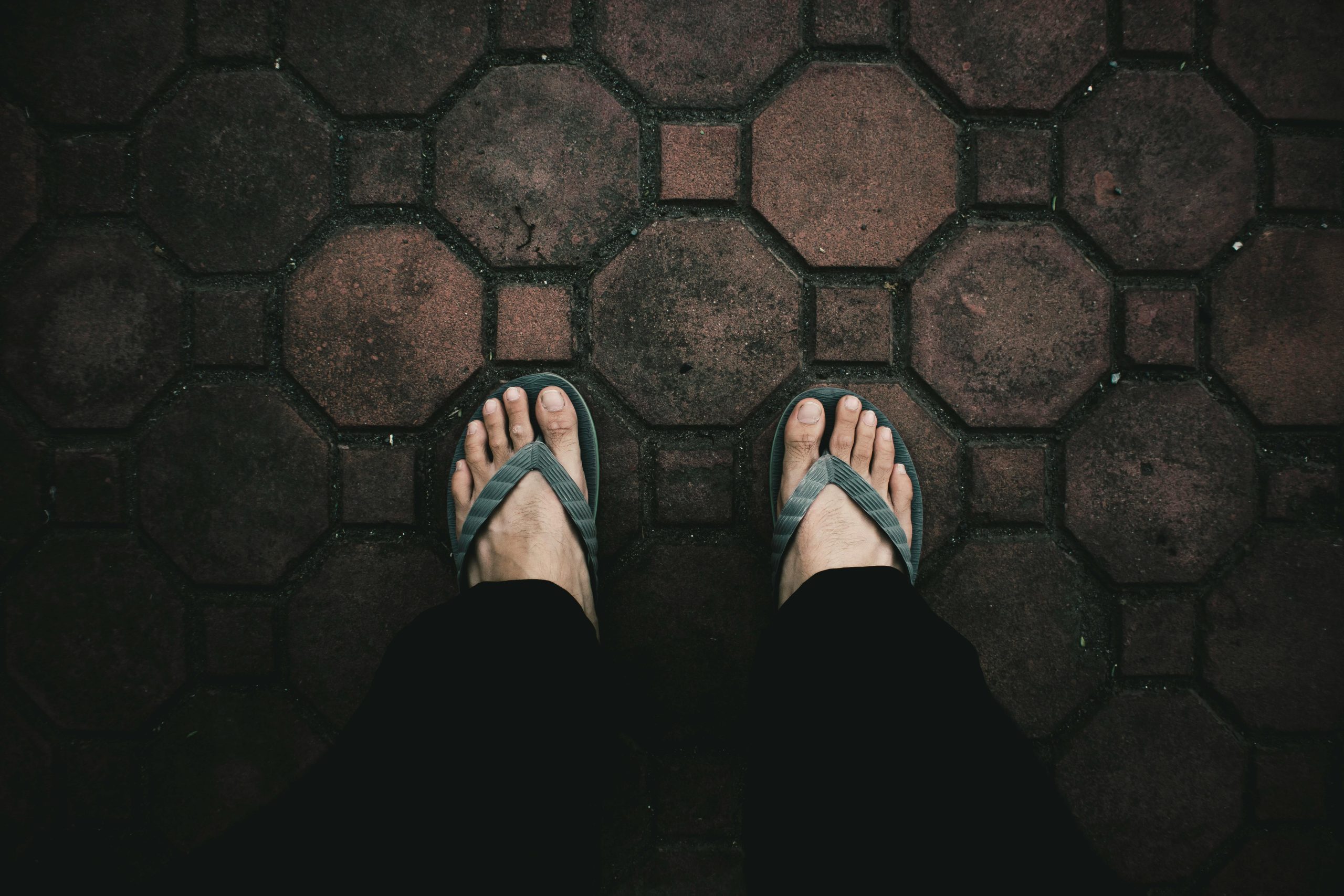 Person standing on pavers