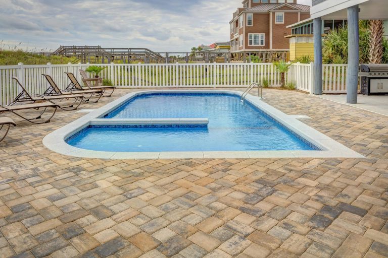 Paver patio with a pool